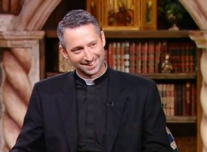 Image of Father Richard Kunst with books in the background